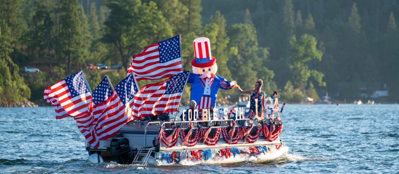 boat on water covered with American flags