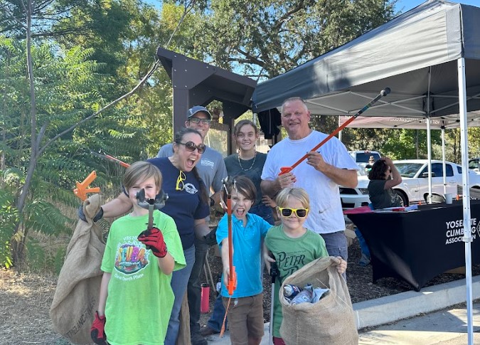 A family helps out at a community clean up event. 