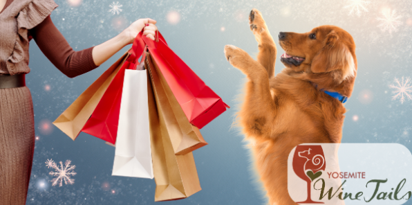 Winter background as a woman holds out a hand full of holiday shopping bags and her happy golden retriever dog is jumping joyfully.