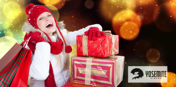 Woman laughing joyfully as she is Christmas shopping.