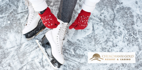 Woman putting on her ice skates.