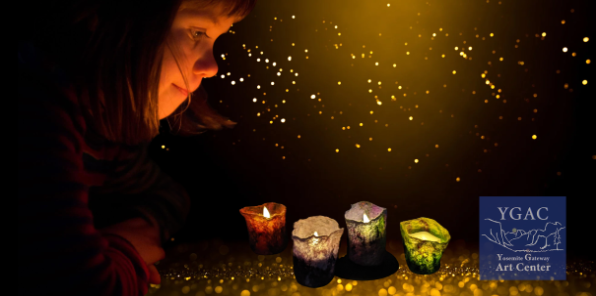 Little girl looking at small felt tea light lanterns. 