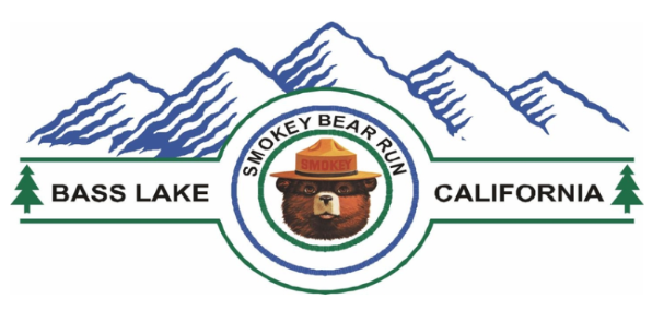 Logo for the Smokey Bear Run with mountains and trees. 