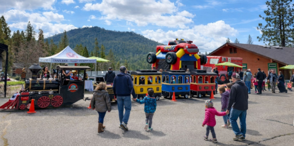 Families with young children enjoying Kids' Day at Bass Lake.