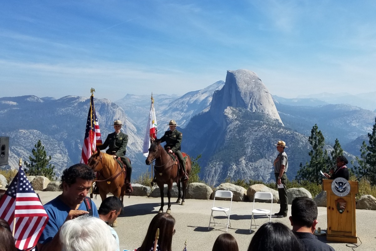 Beautiful view from Glacier Point with rangers and flags
