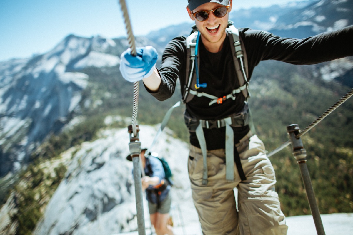 Person on Half Dome cables having fun.